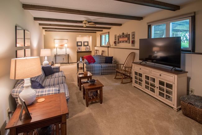 Another view of the lower level family room with lookout windows | Image 14