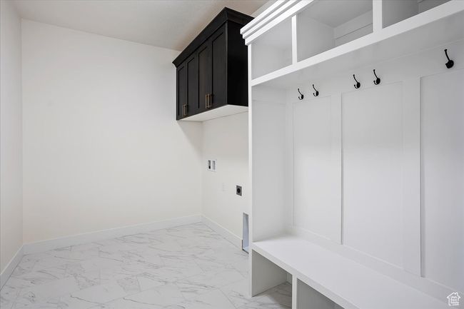 Mudroom featuring baseboards and marble finish floor | Image 13