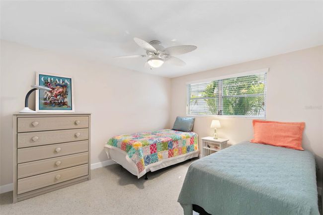 View of the guest bedroom as you enter the room. | Image 19