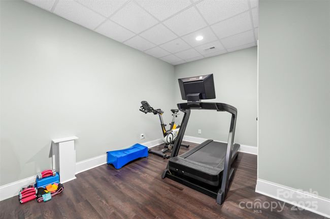 Exercise room in the basement with a large closet. | Image 34