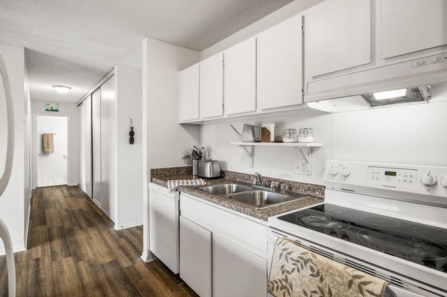 Many kitchen cabinets on both sides | Image 5