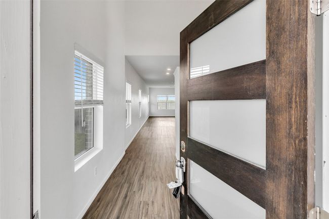 Corridor with wood finished floors and baseboards | Image 4