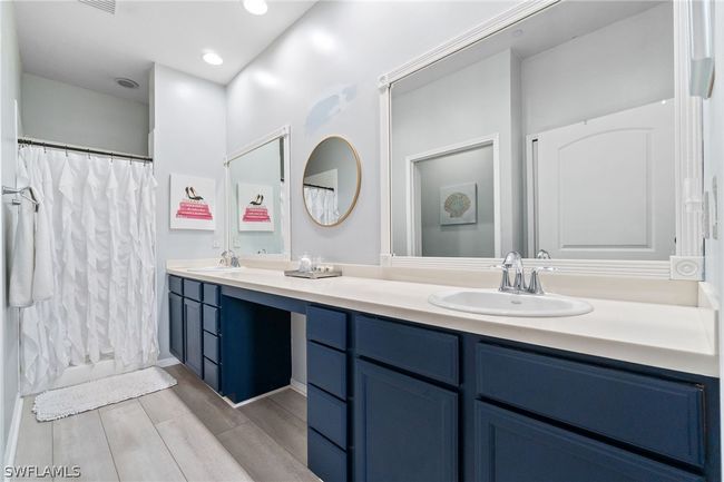 Bathroom featuring double vanity and toilet | Image 39