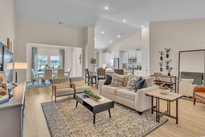 Living room featuring light hardwood / wood-style floors and high vaulted ceiling | Image 2