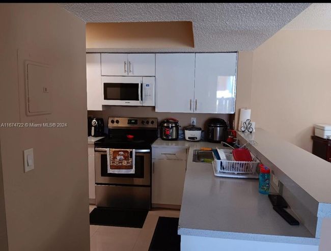 APT-108 - 18870 Nw 57 Th Ave, Condo with 2 bedrooms, 2 bathrooms and null parking in Hialeah FL | Image 24