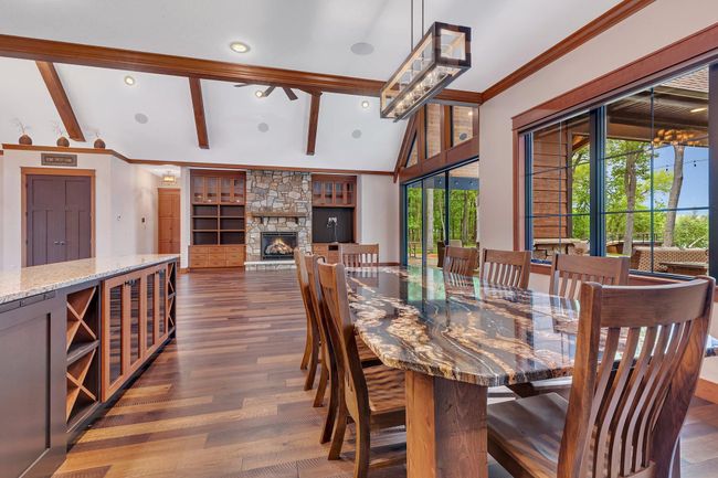 Open-concept dining area with plenty of natural light and room to gather. | Image 40