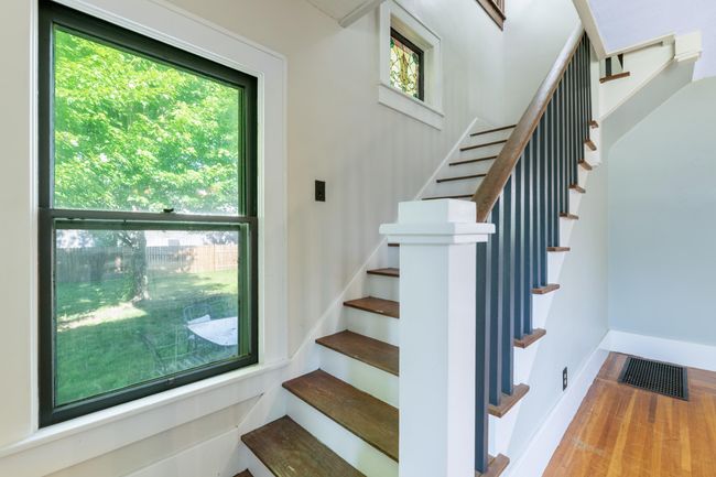 Stairway with wood finished floors and baseboards | Image 18