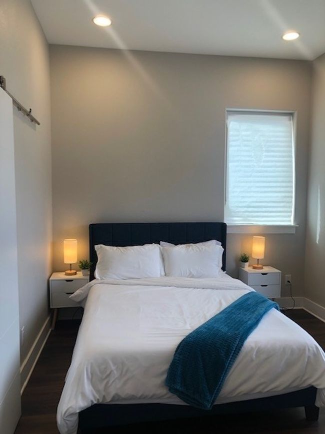 Primary Bedroom featuring recessed lighting, a barn door, baseboards, and dark wood finished floors | Image 20