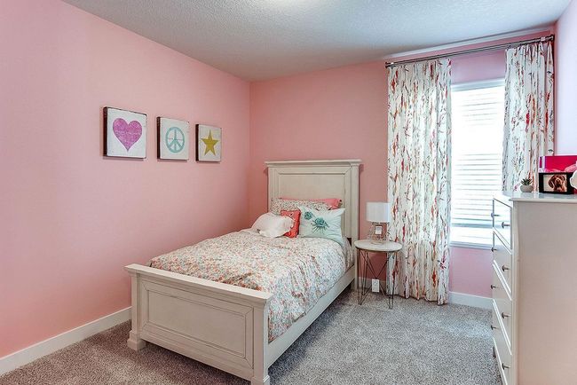 Another upper-level bedroom with abundant space and a walk-in closet! Photo of Model Home. Options and colors may vary. Ask Sales Agent for details. | Image 29