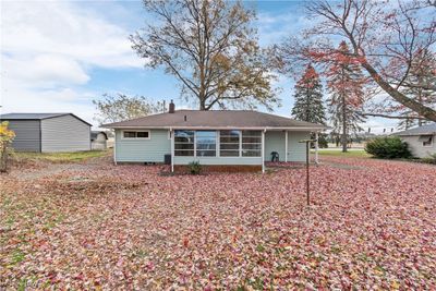 Back of property featuring a storage unit | Image 3