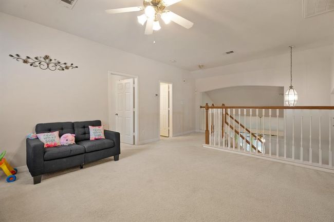 Your new game room is spacious and open to the downstairs, making it a great play space for young and old! | Image 16