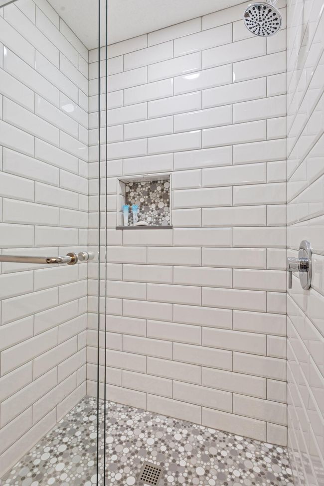 This bath features a walk-in shower | Image 15