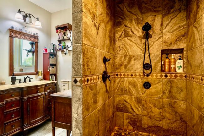 Bathroom featuring vanity and walk in shower | Image 22