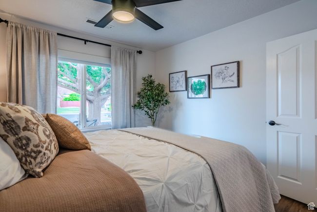 Bedroom featuring ceiling fan and wood-type flooring | Image 42