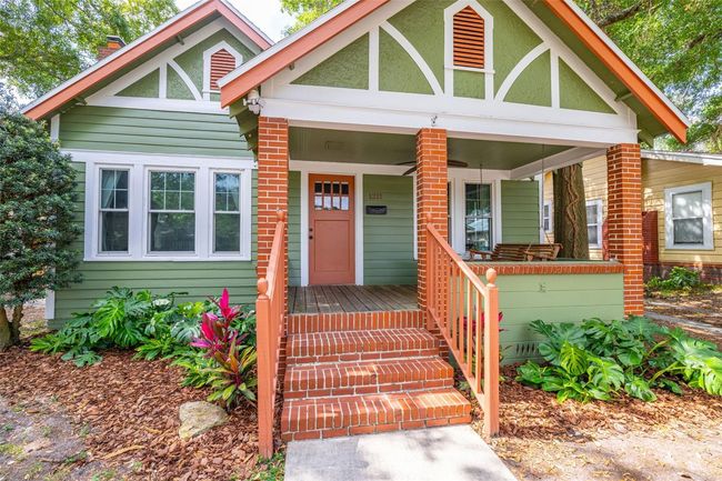 A covered porch with swing awaits you. | Image 5