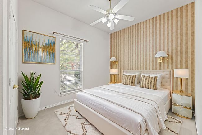Bedroom featuring wallpapered walls, carpet, and a ceiling fan | Image 32