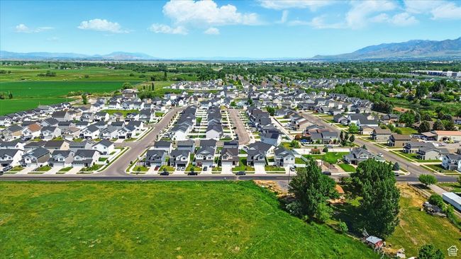 Aerial view of property's location featuring a mountainous background and nearby suburban area | Image 31