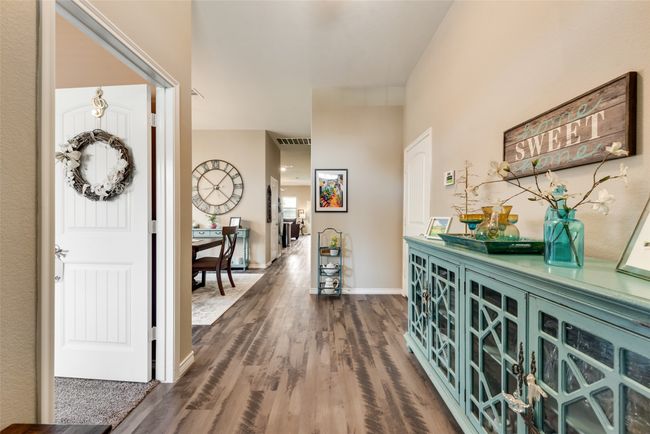 Entryway with dark wood-type flooring and baseboards | Image 5