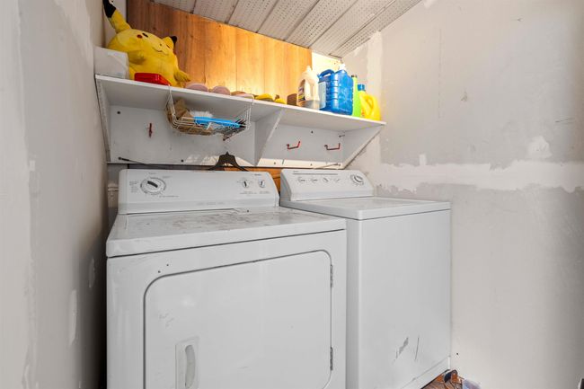 Laundry area with washing machine and clothes dryer and laundry area | Image 28