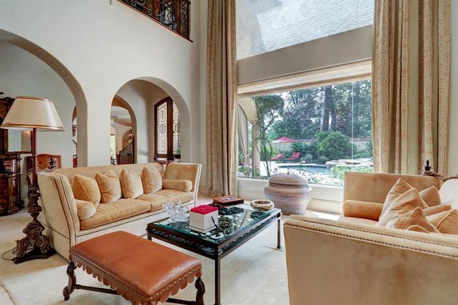 Formal living room view of the backyard. | Image 9