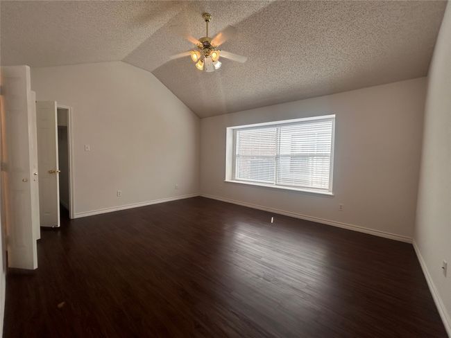 Master bedroom with its expansive space and nice sized closet by a decent size master bathroom will make you smile | Image 6