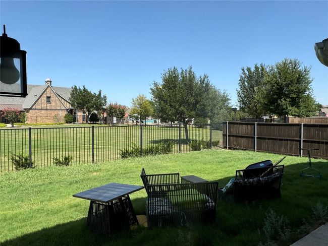 View of fenced backyard | Image 14