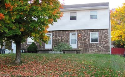 View of front facade with a front lawn | Image 2