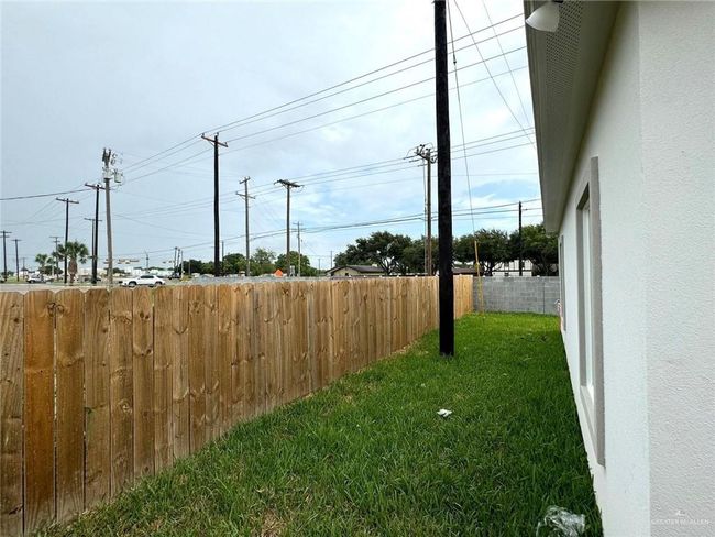 View of yard featuring fence | Image 12