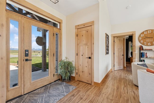 Foyer with wood finished floors and baseboards | Image 17
