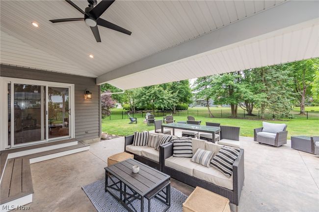 View of terrace with an outdoor living space and ceiling fan | Image 47