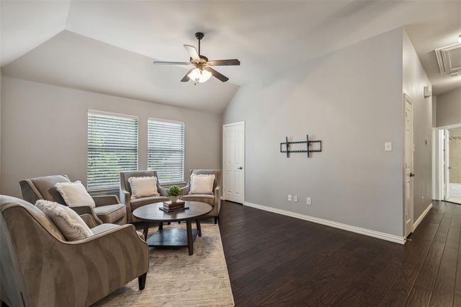 Living room featuring dark hardwood / wood-style floors, ceiling fan, and vaulted ceiling | Image 20