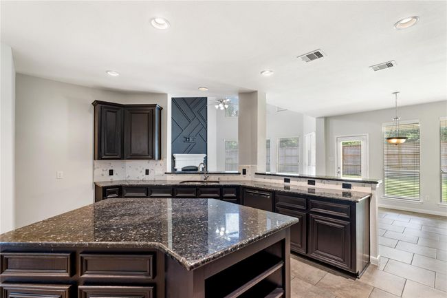 Kitchen view leading into main living area | Image 11