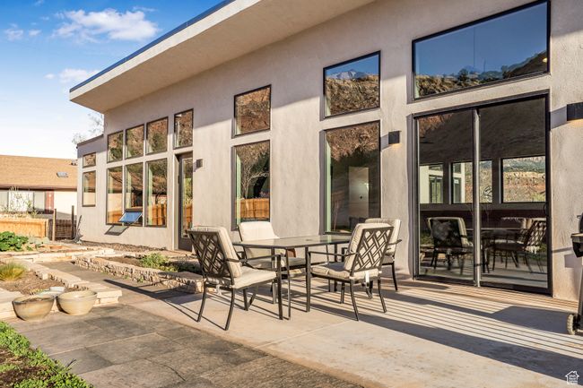View of patio with fence and outdoor dining area | Image 44