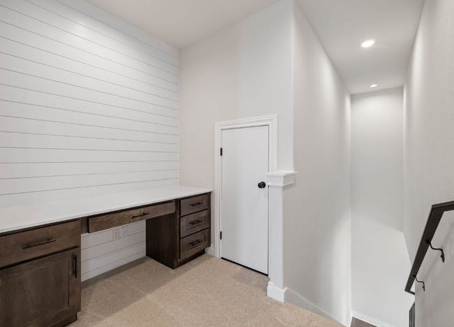 Unfurnished office featuring recessed lighting, built in study area, light carpet, and baseboards | Image 27