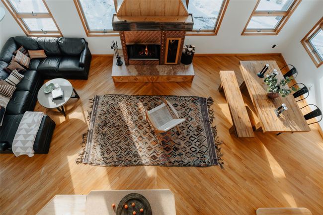 Living room with hardwood / wood-style floors, and a tile fireplace | Image 7