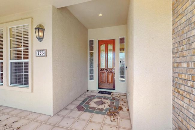 Property entrance with stucco siding | Image 5