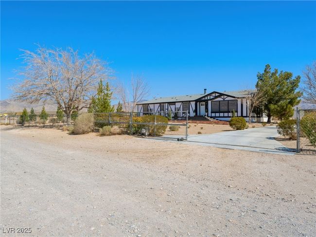 View of front of house with a fenced front yard | Image 6