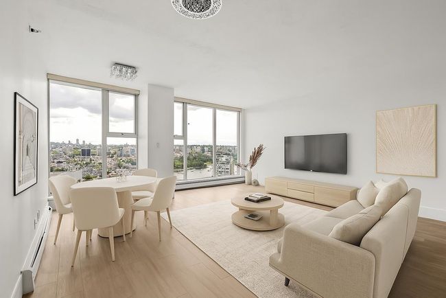 Living area featuring light wood finished floors and baseboard heating | Image 5