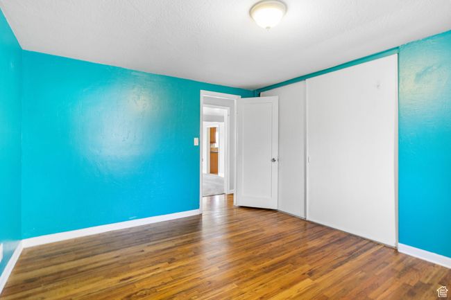 Unfurnished room featuring baseboards and wood finished floors | Image 38