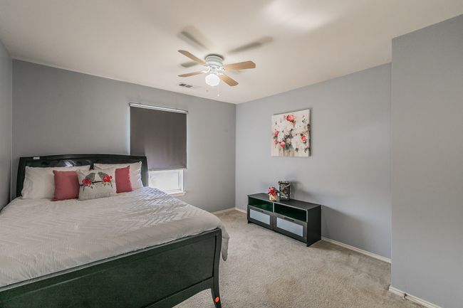 Carpeted bedroom with baseboards and a ceiling fan | Image 29