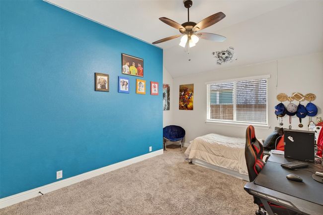 Bedroom with carpet, an office area, lofted ceiling, and ceiling fan | Image 22