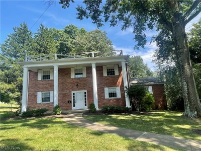 Greek revival house with a front yard | Image 3