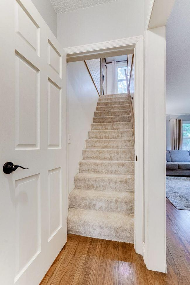 Door to primary bedroom for added privacy and sound barrier | Image 15