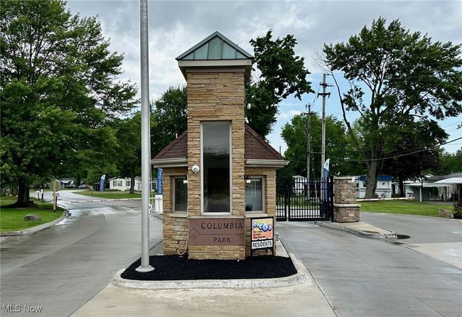 View of property's community with a gate | Image 13