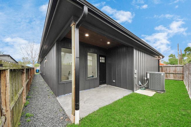 Step into the backyard oasis, with a covered patio, creating aninviting outdoor retreat. | Image 29