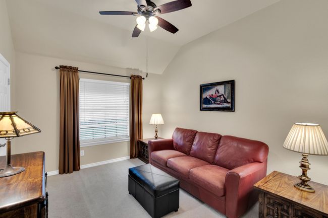 2nd Bedroom on 1st floor with closet and fan currently used as a 2nd living room | Image 24