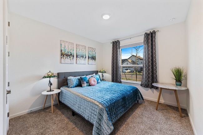 Carpeted bedroom featuring baseboards | Image 19