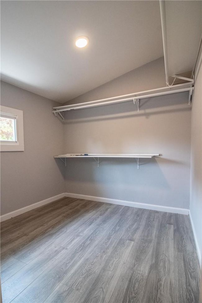 Spacious closet with hardwood / wood-style floors | Image 10