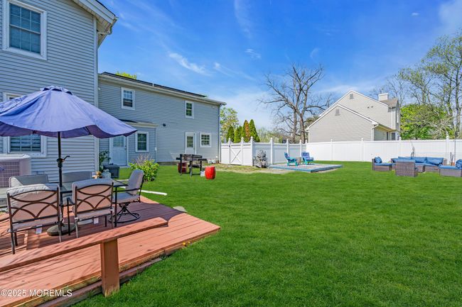 Enclosed fenced yard provides room for children and dogs to enjoy. *grass has been colorized | Image 33