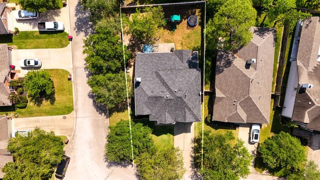 A bird’s-eye view directly above the home, showcasing the spacious corner lot. This perspective highlights the property’s generous size and prime location within the Windrose community, offering plenty of room for both outdoor living and privacy. | Image 38